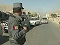 Afghan National Police checking cars at polling stations