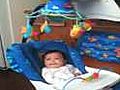 Baby Ariana in her new aquarium cradle swing