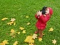 Little girl throws up toy dog outdoor