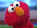 Elmo Tackles Finance and Urges Kids to Save