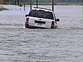 Reporter Saves Woman From Floods