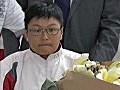 受槍傷女棒手返港　稱傷口仍痛楚但無大礙