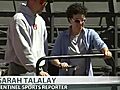 Sun Sentinel sports writer Sarah Talalay lays sod with grounds crew at Sun Life Stadium