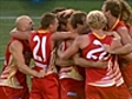 Suns win first game by downing Port