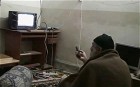 Osama bin Laden watching himself on TV