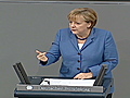 Merkel balances politics and markets