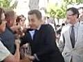 Man grabs Nicolas Sarkozy
