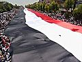 Raw Video: Assad supporters unfurl massive flag