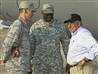 New defense secretary visits war zones