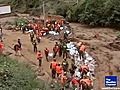 Cars swept away by landslide