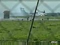 Plane crash lands on runway