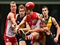 Swans prevail in wet conditions