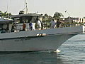 Royalty Free Stock Video SD Footage Fishing Boat Departs at Lighthouse Point in Deerfield Beach,  Florida