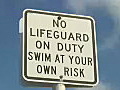 Royalty Free Stock Video HD Footage No Lifeguard on Duty Sign in Key West Florida