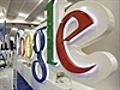 Dow falls,  but Google pushes Nasdaq up