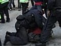 G20 police manhandle protesters to the ground