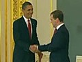 Obama and Medvedev signing the agreement.