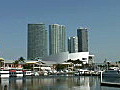 Royalty Free Stock Video HD Footage Zoom Out to High Rise Condos and Office Buildings and Marina at Bayside in Downtown Miami,  Florida