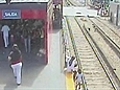 Child on train tracks CCTV