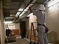 Royalty Free Stock Video SD Footage Electrician Feed Wire Into Conduit at a Construction Site in Downtown Ft. Lauderdale,  Florida