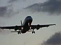 Royalty Free Stock Video HD Footage Airbus Commercial Jet on Final Approach at Sunset at Ft. Lauderdale Airport in Florida