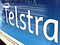 Telstra takes impairment charge