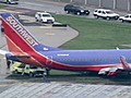 Plane slides off Chicago runway