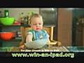 Funny baby eating spaghetti for the very first time