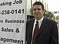 [Video] Man takes job search to streets of downtown Tampa wearing suit,  tie and armed with a sign