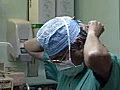 Royalty Free Stock Video SD Footage Hospital Worker Adjusts Face Mask