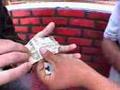 A Dollar is turned inside out as a guy goes crazy! Magic!