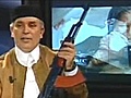 Weird News - Libyan News Anchor Holds AK-47 On Air