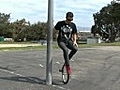 How to Ride a Unicycle : Unicycle Wheel Walk Trick