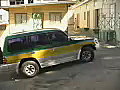 Stock Video Car Departs from a Parking Lot on the Island of Tobago Royalty-Free SD Footage