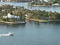 Royalty Free Stock Video HD Footage Pan Right as Boat Passes by on the Intracoastal Waterway on Fort Lauderdale Beach as Viewed from the 29th Floor of a Condo