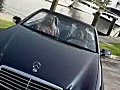 Royalty Free Stock Video SD Footage Zoom Into Boy and Girl Talking in a Convertible Car in Ft. Lauderdale,  Florida