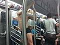 Pole dancer performs on NYC train