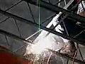 Royalty Free Stock Video SD Footage Welder Welds Roof Joists at a Construction Site in Ft. Lauderdale,  Florida