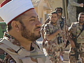 On patrol with an imam,  female soldiers