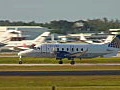 Royalty Free Stock Video HD Footage Commercial Propeller Aircraft Taxi’s to the End of the Runway in Ft. Lauderdale,  Florida