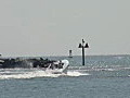 Royalty Free Stock Video HD Footage Power Speed Boat Departs From Lighthouse Point in Deerfield Beach,  Florida