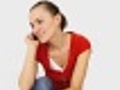 Woman sitting with telephone