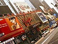 Royalty Free Stock Video SD Footage Zoom Out From Sign to Traffic and Street in Times Square on a Hot Hazy Day in New York City