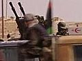 Rebels near Brega,  Gaddafi on tv
