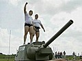 Two Men Pull a Tank