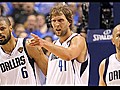 Dirk fights off Heat