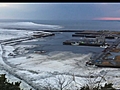 Tsunami engulfing fishing port