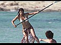 Michelle Rodriguez Paddle Boards In Spain