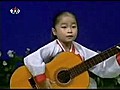 Little Girl Rocks at Guitar