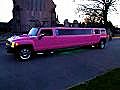 Pink Stretch Hummer Limo drive by